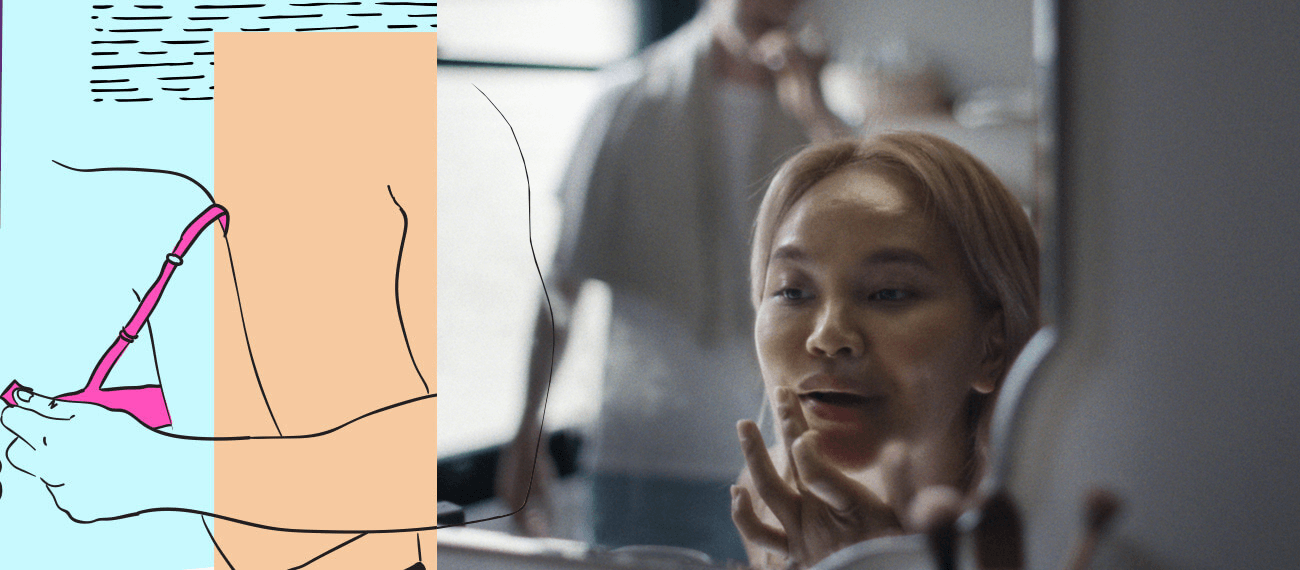 woman looking at herself in the mirror